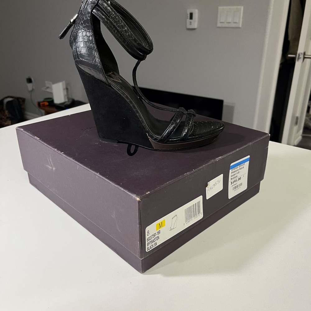 Exotic snakeskin/suede wedge.